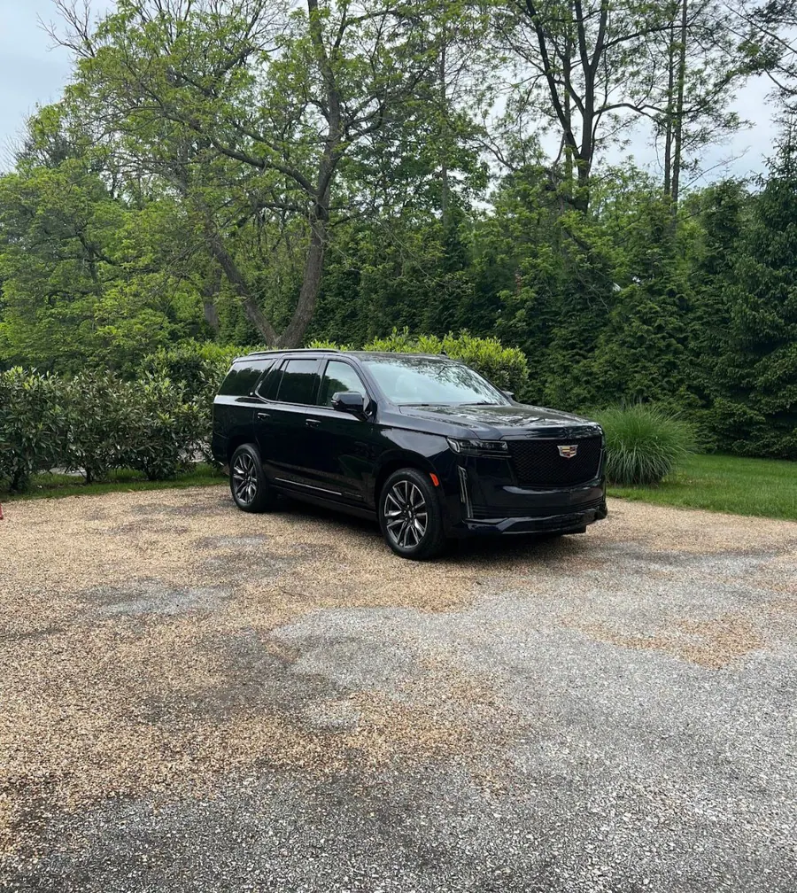 Black Cadillac Escalade delivered at a client's home