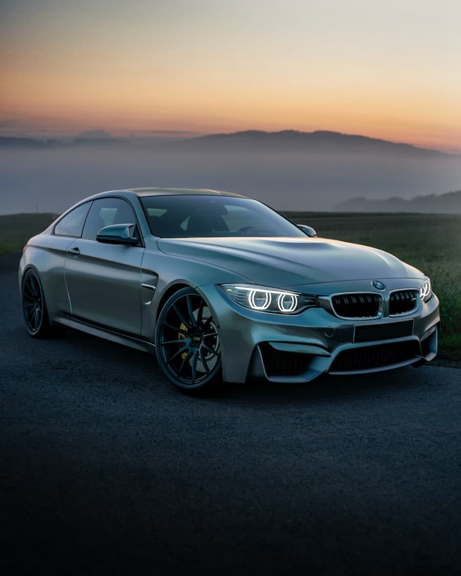 BMW M4 parked on a country road at amber sunset