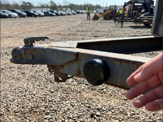 GPS tracker mounted on a trailer hitch for equipment tracking