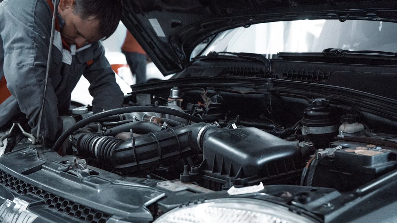 A mechanic inspecting a car engine