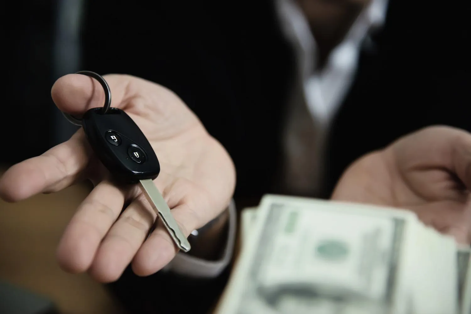 Car keys changing hands after a private sale